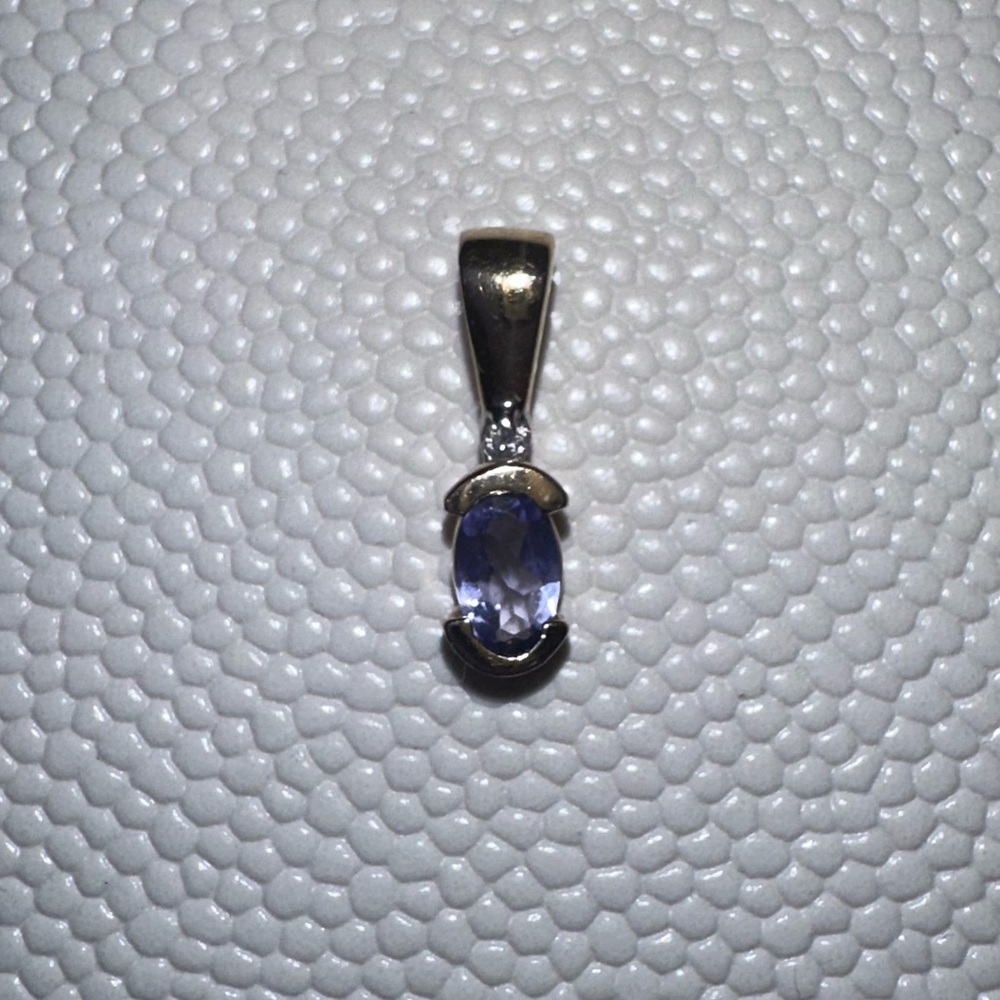 14k gold Amethyst pendant with tiny diamond accent.